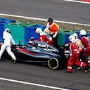 Marshalls and Fernando Alonso (ESP) McLaren MP4-30 push his car in Q2 at Formula One World Championship, Rd10, Hungarian Grand Prix, Qualifying, Hungaroring, Hungary, Saturday 25 July 2015. © Sutton Motorsport Images