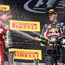Race winner Sebastian Vettel (GER) Ferrari, James Allison (GBR) Ferrari Chassis Technical Director, Daniel Ricciardo (AUS) Red Bull Racing and Daniil Kvyat (RUS) Red Bull Racing celebrate on the podium with the champagne at Formula One World Championship, Rd10, Hungarian Grand Prix, Race, Hungaroring, Hungary, Sunday 26 July 2015. © Sutton Motorsport Images