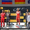 (L to R): Daniil Kyvat (RUS) Red Bull Racing, Race winner Sebastian Vettel (GER) Ferrari and Daniel Ricciardo (AUS) Red Bull Racing celebrate  on the podium at Formula One World Championship, Rd10, Hungarian Grand Prix, Race, Hungaroring, Hungary, Sunday 26 July 2015. © Sutton Motorsport Images