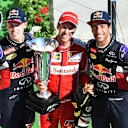 Daniil Kyvat (RUS) Red Bull Racing, race winner Sebastian Vettel (GER) Ferrari and Daniel Ricciardo (AUS) Red Bull Racing celebrate with the trophies on the podium at Formula One World Championship, Rd10, Hungarian Grand Prix, Race, Hungaroring, Hungary, Sunday 26 July 2015. © Sutton Motorsport Images