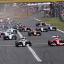 Nico Rosberg (GER) Mercedes AMG F1 W06, Lewis Hamilton (GBR) Mercedes AMG F1 W06, Sebastian Vettel (GER) Ferrari SF15-T and Kimi Raikkonen (FIN) Ferrari SF15-T at the start of the race at Formula One World Championship, Rd10, Hungarian Grand Prix, Race, Hungaroring, Hungary, Sunday 26 July 2015. © Sutton Motorsport Images