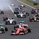 Nico Rosberg (GER) Mercedes AMG F1 W06, Lewis Hamilton (GBR) Mercedes AMG F1 W06, Sebastian Vettel (GER) Ferrari SF15-T and Kimi Raikkonen (FIN) Ferrari SF15-T at the strat of the race at Formula One World Championship, Rd10, Hungarian Grand Prix, Race, Hungaroring, Hungary, Sunday 26 July 2015. © Sutton Motorsport Images