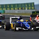 Marcus Ericsson (SWE) Sauber C34, Felipe Nasr (BRA) Sauber C34 and Roberto Merhi (ESP) Manor GP battle at Formula One World Championship, Rd10, Hungarian Grand Prix, Race, Hungaroring, Hungary, Sunday 26 July 2015. © Sutton Motorsport Images