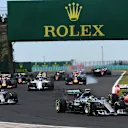 Nico Rosberg (GER) Mercedes AMG F1 W06 and Kimi Raikkonen (FIN) Ferrari SF15-T battle at the strat of the race at Formula One World Championship, Rd10, Hungarian Grand Prix, Race, Hungaroring, Hungary, Sunday 26 July 2015. © Sutton Motorsport Images