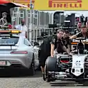 FIA safety car passes the Force India VJM08 as its pushed down the pitlane by mechanics at Formula One World Championship, Rd10, Hungarian Grand Prix, Preparations, Hungaroring, Hungary, Thursday 23 July 2015. © Sutton Motorsport Images