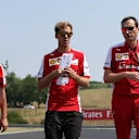 Sebastian Vettel (GER) Ferrari walks the track with Riccardo Adami (ITA) Ferrari Engineer the track at Formula One World Championship, Rd10, Hungarian Grand Prix, Preparations, Hungaroring, Hungary, Thursday 23 July 2015. © Sutton Motorsport Images