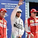 Pole sitter Lewis Hamilton (GBR) Mercedes AMG F1, Sebastian Vettel (GER) Ferrari and Kimi Raikkonen (FIN) Ferrari celebrate in parc ferme at Formula One World Championship, Rd12, Italian Grand Prix, Qualifying, Monza, Italy, Saturday 5 September 2015. © Sutton Motorsport Images