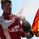 Sebastian Vettel (GER) Ferrari celebrates with champagne on the podium at Formula One World Championship, Rd12, Italian Grand Prix, Race, Monza, Italy, Sunday 6  September 2015. © Sutton Motorsport Images
