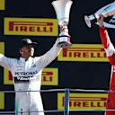 Race winner Lewis Hamilton (GBR) Mercedes AMG F1 and Sebastian Vettel (GER) Ferrari celebrate on the podium with the trophies at Formula One World Championship, Rd12, Italian Grand Prix, Race, Monza, Italy, Sunday 6  September 2015. © Sutton Motorsport Images