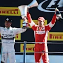 Race winner Lewis Hamilton (GBR) Mercedes AMG F1 and Sebastian Vettel (GER) Ferrari celebrate on the podium with the trophies at Formula One World Championship, Rd12, Italian Grand Prix, Race, Monza, Italy, Sunday 6  September 2015. © Sutton Motorsport Images