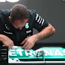 Mercedes mechanic works on Mercedes AMG F1 W06 rear wing at Formula One World Championship, Rd14, Japanese Grand Prix, Practice, Suzuka, Japan, Friday 25 September 2015. © Sutton Motorsport Images