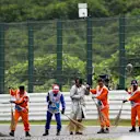 Marshals clean the track at Formula One World Championship, Rd14, Japanese Grand Prix, Qualifying, Suzuka, Japan, Saturday 26 September 2015. © Sutton Motorsport Images
