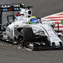 Felipe Massa (BRA) Williams FW37 with front puncture on lap one at Formula One World Championship, Rd14, Japanese Grand Prix, Race, Suzuka, Japan, Sunday 27 September 2015. © Sutton Motorsport Images