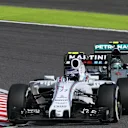 Valtteri Bottas (FIN) Williams FW37 and Nico Rosberg (GER) Mercedes AMG F1 W06 battle for position at Formula One World Championship, Rd14, Japanese Grand Prix, Race, Suzuka, Japan, Sunday 27 September 2015. © Sutton Motorsport Images