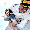 Race winner Lewis Hamilton (GBR) Mercedes AMG F1 celebrates on the podium with champagne at Formula One World Championship, Rd14, Japanese Grand Prix, Race, Suzuka, Japan, Sunday 27 September 2015. © Sutton Motorsport Images