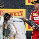 Nico Rosberg (GER) Mercedes AMG F1, Race winner Lewis Hamilton (GBR) Mercedes AMG F1 and Sebastian Vettel (GER) Ferrari celebrate with the champagne on the podium at Formula One World Championship, Rd14, Japanese Grand Prix, Race, Suzuka, Japan, Sunday 27 September 2015. © Sutton Motorsport Images