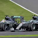 Lewis Hamilton (GBR) Mercedes AMG F1 W06and Nico Rosberg (GER) Mercedes AMG F1 W06 battle at the start of the race  at Formula One World Championship, Rd14, Japanese Grand Prix, Race, Suzuka, Japan, Sunday 27 September 2015. © Sutton Motorsport Images