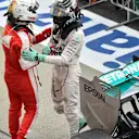 Sebastian Vettel (GER) Ferrari and Nico Rosberg (GER) Mercedes AMG F1 celebrate in parc ferme at Formula One World Championship, Rd14, Japanese Grand Prix, Race, Suzuka, Japan, Sunday 27 September 2015. © Sutton Motorsport Images