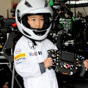 Young fan with McLaren MP4-30 steering wheel at Formula One World Championship, Rd14, Japanese Grand Prix, Preparations, Suzuka, Japan, Thursday 24 September 2015. © Sutton Motorsport Images