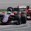 Fernando Alonso (ESP) McLaren MP4-30 leads Kimi Raikkonen (FIN) Ferrari SF15-T at Formula One World Championship, Rd2, Malaysian Grand Prix, Practice, Sepang, Malaysia, Friday 27  March 2015. © Sutton Motorsport Images