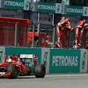 Race winner Sebastian Vettel (GER) Ferrari SF15-T crosses the line Formula One World Championship, Rd2, Malaysian Grand Prix, Race, Sepang, Malaysia, Sunday 29 March 2015. © Sutton Motorsport Images