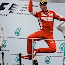 Race winner Sebastian Vettel (GER) Ferrari celebrates on the podium at Formula One World Championship, Rd2, Malaysian Grand Prix, Race, Sepang, Malaysia, Sunday 29 March 2015. © Sutton Motorsport Images