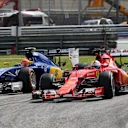 Sebastian Vettel (GER) Ferrari SF15-T and Felipe Nasr (BRA) Sauber C34 battle at Formula One World Championship, Rd2, Malaysian Grand Prix, Race, Sepang, Malaysia, Sunday 29 March 2015. © Sutton Motorsport Images