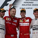 Podium (L to R): Second placed Lewis Hamilton (GBR) Mercedes AMG F1, Diego Ioverno (ITA) Ferrari Operations Director, race winner Sebastian Vettel (GER) Ferrari and Nico Rosberg (GER) Mercedes AMG F1 celebrate on the podium at Formula One World Championship, Rd2, Malaysian Grand Prix, Race, Sepang, Malaysia, Sunday 29 March 2015. © Sutton Motorsport Images