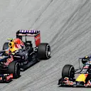 Daniil Kvyat (RUS) Red Bull Racing RB11 and Daniel Ricciardo (AUS) Red Bull Racing RB11 battle at Formula One World Championship, Rd2, Malaysian Grand Prix, Race, Sepang, Malaysia, Sunday 29 March 2015. © Sutton Motorsport Images
