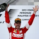 Race winner Sebastian Vettel (GER) Ferrari celebrates on the podium with the trophy at Formula One World Championship, Rd2, Malaysian Grand Prix, Race, Sepang, Malaysia, Sunday 29 March 2015. © Sutton Motorsport Images