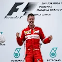 Race winner Sebastian Vettel (GER) Ferrari celebrates on the podium with Lewis Hamilton (GBR) Mercedes AMG F1 and Nico Rosberg (GER) Mercedes AMG F1 at Formula One World Championship, Rd2, Malaysian Grand Prix, Race, Sepang, Malaysia, Sunday 29 March 2015. © Sutton Motorsport Images