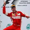 Race winner Sebastian Vettel (GER) Ferrari celebrates on the podium at Formula One World Championship, Rd2, Malaysian Grand Prix, Race, Sepang, Malaysia, Sunday 29 March 2015. © Sutton Motorsport Images