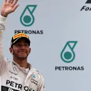 Lewis Hamilton (GBR) Mercedes AMG F1 celebrates on the podium at Formula One World Championship, Rd2, Malaysian Grand Prix, Race, Sepang, Malaysia, Sunday 29 March 2015. © Sutton Motorsport Images