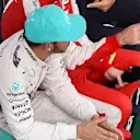 Lewis Hamilton (GBR) Mercedes AMG F1 and Sebastian Vettel (GER) Ferrari sit down on the podium with Eddie Jordan (IRE) BBC Television Pundit at Formula One World Championship, Rd2, Malaysian Grand Prix, Race, Sepang, Malaysia, Sunday 29 March 2015. © Sutton Motorsport Images
