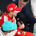 Lewis Hamilton (GBR) Mercedes AMG F1 and Sebastian Vettel (GER) Ferrari sit on the podium with Eddie Jordan (IRE) BBC Television Pundit at Formula One World Championship, Rd2, Malaysian Grand Prix, Race, Sepang, Malaysia, Sunday 29 March 2015. © Sutton Motorsport Images