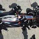 Jenson Button (GBR) McLaren MP4-30 retires from the race in the pits at Formula One World Championship, Rd2, Malaysian Grand Prix, Race, Sepang, Malaysia, Sunday 29 March 2015. © Sutton Motorsport Images