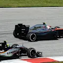 Sergio Perez (MEX) Force India VJM08 and Jenson Button (GBR) McLaren MP4-30 at Formula One World Championship, Rd2, Malaysian Grand Prix, Race, Sepang, Malaysia, Sunday 29 March 2015. © Sutton Motorsport Images