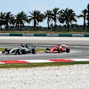 Lewis Hamilton (GBR) Mercedes AMG F1 W06 and Kimi Raikkonen (FIN) Ferrari SF15-T at Formula One World Championship, Rd2, Malaysian Grand Prix, Practice, Sepang, Malaysia, Friday 27  March 2015. © Sutton Motorsport Images