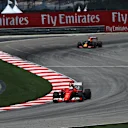 Sebastian Vettel (GER) Ferrari SF15-T leads Daniel Ricciardo (AUS) Red Bull Racing RB11 at Formula One World Championship, Rd2, Malaysian Grand Prix, Practice, Sepang, Malaysia, Friday 27  March 2015. © Sutton Motorsport Images