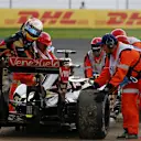Marshals and Romain Grosjean (FRA) Lotus E23 Hybrid at Formula One World Championship, Rd17, Mexican Grand Prix, Practice, Circuit Hermanos Rodriguez, Mexico City, Mexico, Friday 30 October 2015. © Sutton Motorsport Images
