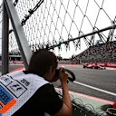 Sebastian Vettel (GER) Ferrari SF15-T and photographer at Formula One World Championship, Rd17, Mexican Grand Prix, Qualifying, Circuit Hermanos Rodriguez, Mexico City, Mexico, Saturday 31 October 2015. © Sutton Motorsport Images