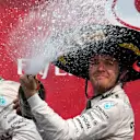 Lewis Hamilton (GBR) Mercedes AMG F1 and Race winner Nico Rosberg (GER) Mercedes AMG F1 celebrates with the champagne on the podium at Formula One World Championship, Rd17, Mexican Grand Prix, Race, Circuit Hermanos Rodriguez, Mexico City, Mexico, Sunday 1  November 2015. © Sutton Motorsport Images