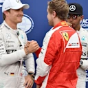 Nico Rosberg (GER) Mercedes AMG F1 and Sebastian Vettel (GER) Ferrari celebrate in parc ferme with Lewis Hamilton (GBR) Mercedes AMG F1 at Formula One World Championship, Rd6, Monaco Grand Prix Qualifying, Monte-Carlo, Monaco, Saturday 23 May 2015. © Sutton Motorsport Images