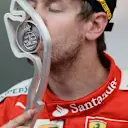 Sebastian Vettel (GER) Ferrari celebrates by kissing the trophy on the podium at Formula One World Championship, Rd6, Monaco Grand Prix Race, Monte-Carlo, Monaco, Sunday 24 May 2015. © Sutton Motorsport Images