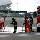 Marshals and Firemen clean the track at Formula One World Championship, Rd15, Russian Grand Prix, Practice, Sochi Autodrom, Sochi, Krasnodar Krai, Russia, Friday 9 October 2015. © Sutton Motorsport Images