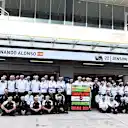 Fernando Alonso (ESP) McLaren celebrates 250 Grands Prix with Eric Boullier (FRA) McLaren Racing Director, Jenson Button (GBR) McLaren and the team at Formula One World Championship, Rd15, Russian Grand Prix, Practice, Sochi Autodrom, Sochi, Krasnodar Krai, Russia, Friday 9 October 2015. © Sutton Motorsport Images