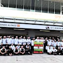 Fernando Alonso (ESP) McLaren celebrates 250 Grands Prix with Eric Boullier (FRA) McLaren Racing Director, Jenson Button (GBR) McLaren and the team at Formula One World Championship, Rd15, Russian Grand Prix, Practice, Sochi Autodrom, Sochi, Krasnodar Krai, Russia, Friday 9 October 2015. © Sutton Motorsport Images