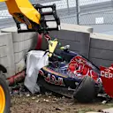 The crashed car of Carlos Sainz (ESP) Scuderia Toro Rosso is recovered from under the tech pro barrier in FP3 at Formula One World Championship, Rd15, Russian Grand Prix, Qualifying, Sochi Autodrom, Sochi, Krasnodar Krai, Russia, Saturday 10 October 2015. © Sutton Motorsport Images