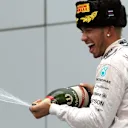 Race winner Lewis Hamilton (GBR) Mercedes AMG F1 celebrates on the podium with champagne at Formula One World Championship, Rd15, Russian Grand Prix, Race, Sochi Autodrom, Sochi, Krasnodar Krai, Russia, Sunday 11 October 2015. © Sutton Motorsport Images