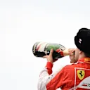 Sebastian Vettel (GER) Ferrari celebrates on the podium with champagne at Formula One World Championship, Rd15, Russian Grand Prix, Race, Sochi Autodrom, Sochi, Krasnodar Krai, Russia, Sunday 11 October 2015. © Sutton Motorsport Images